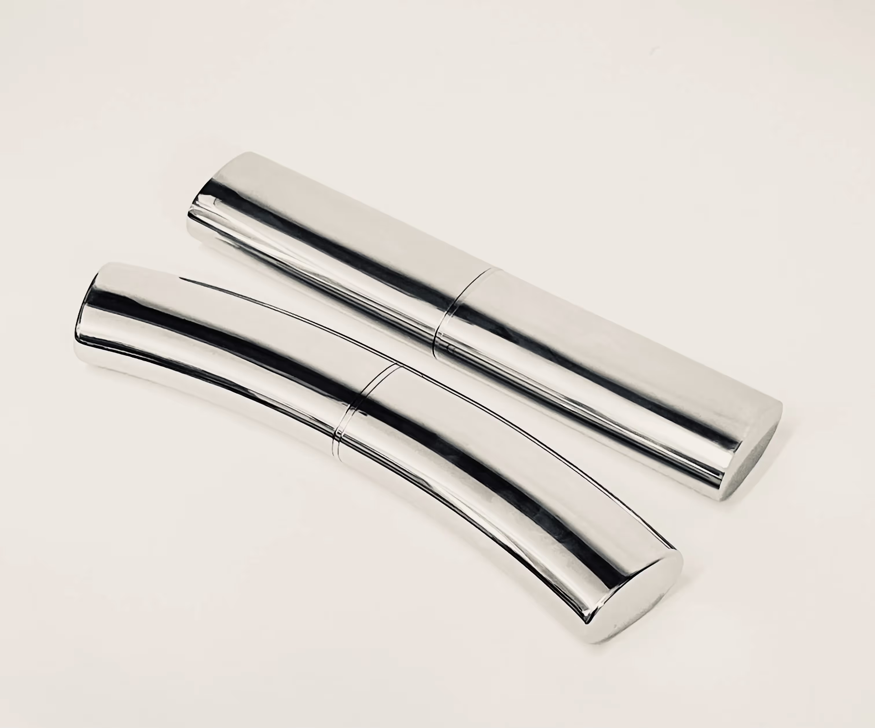 Mechanical Joiners concealed inside a straight piece of oval tubing and a curved piece of oval tubing