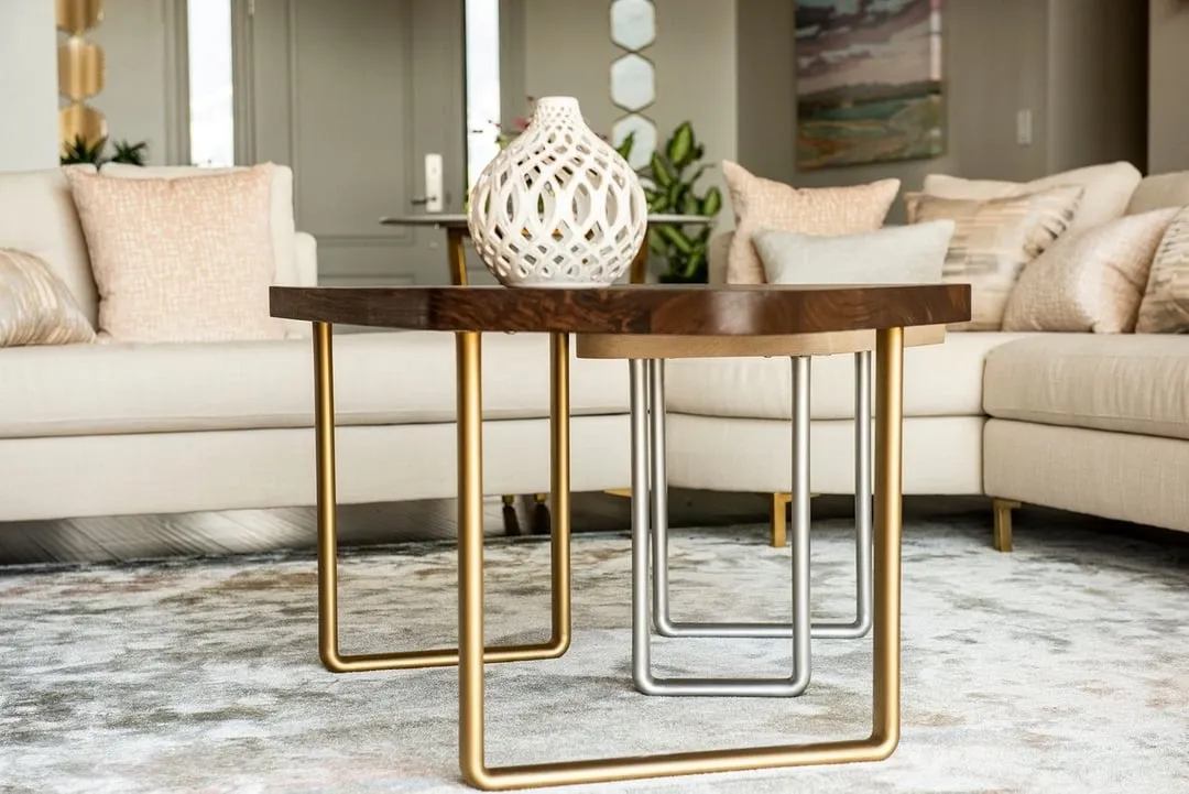 Stainless steel flat-sided oval tubing being used as supports for a designer coffee table.